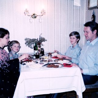 Family dining together indoors at a table.
