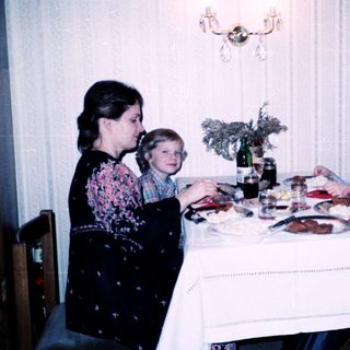 Family dining together indoors at a table.