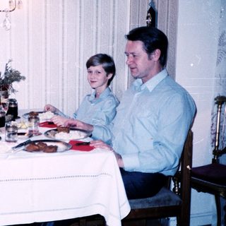 Family dining together indoors at a table.