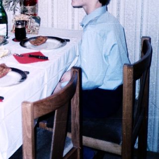 Family dining together indoors during a meal.