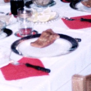 Family dining together indoors during a meal.