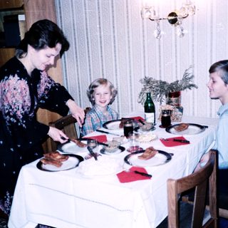 Family dining together indoors during a meal.