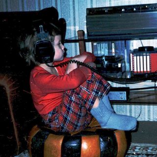 Child playing with vintage electronic music keyboard.