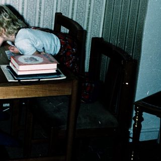 Two children studying together at a table.