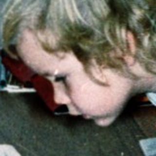 Two children studying together at a table.