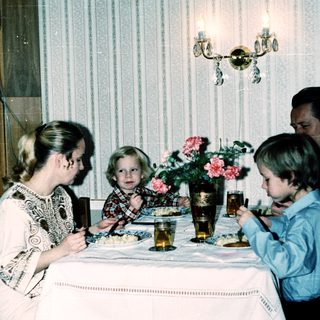 Family dining together indoors during a meal.