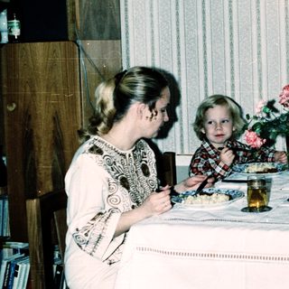Family dining together indoors during a meal.