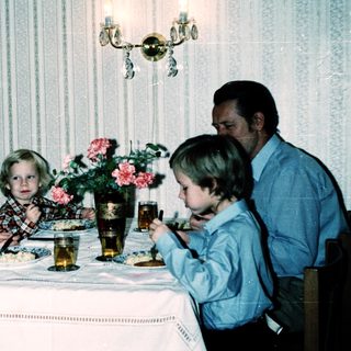 Family dining together indoors during a meal.