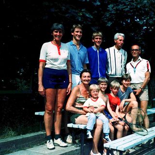 Family group photo at outdoor event or gathering.