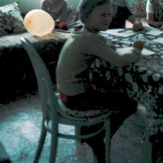 Group playing board games indoors, mid-20th century.