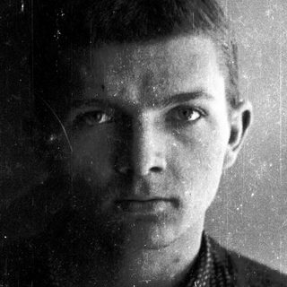 Black-and-white portrait of a young man.