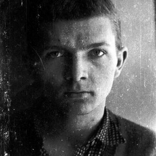 Black-and-white portrait of a young man.