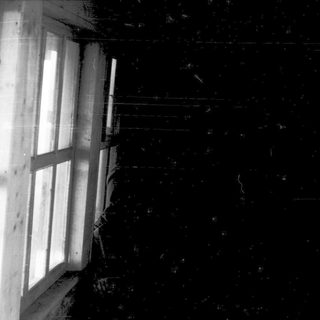 Dark room with single open window revealing light outside.