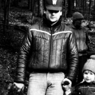 Family hiking in a forested trail.