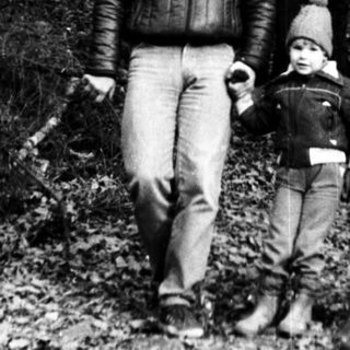 Family hiking in a forested trail.