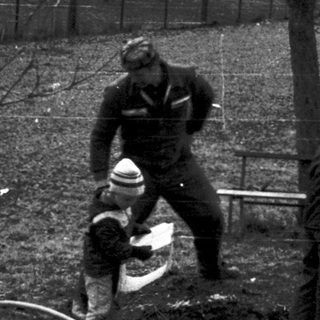 Soldiers clearing land with explosives near a lake.