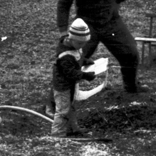 Soldiers clearing land with explosives near a lake.