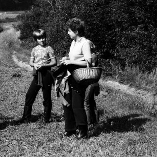Family picnic or outing in rural countryside.