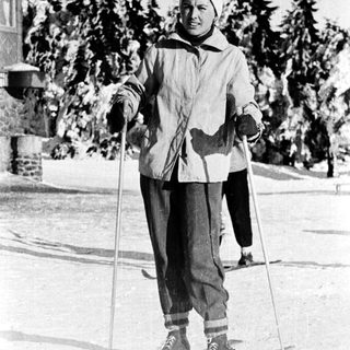 Person cross-country skiing outdoors in winter attire.