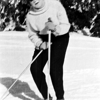 Person cross-country skiing outdoors in winter.