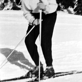 Person cross-country skiing outdoors in winter.