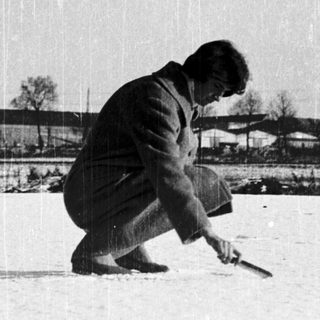 Man shoveling snow in winter.