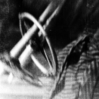 Blurred close-up of person smoking pipe.
