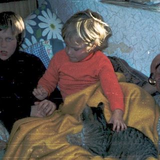 Family sharing a simple indoor moment together.