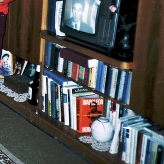 Family playing video game indoors together.