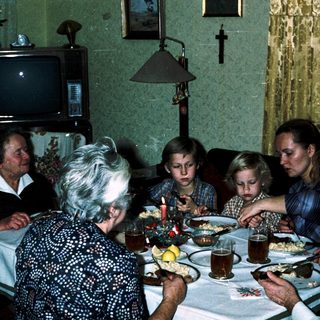 Family gathered around a table for a meal.