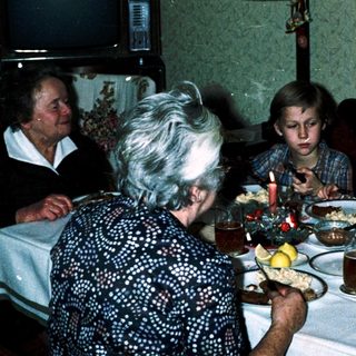 Family gathered around a table for a meal.