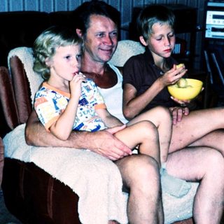 Family enjoying snack time indoors together.
