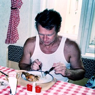 Family sharing meal indoors at table.