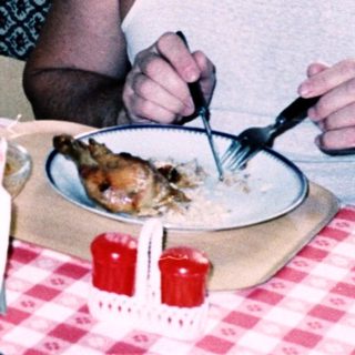 Family sharing meal indoors at table.