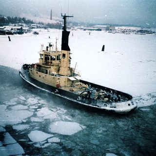 Icebreaker vessel navigating frozen waters.