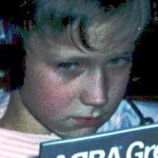 Person listening to ABBA Greatest Hits Vol. 2 album.