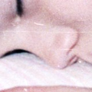 Child sleeping peacefully in bed.