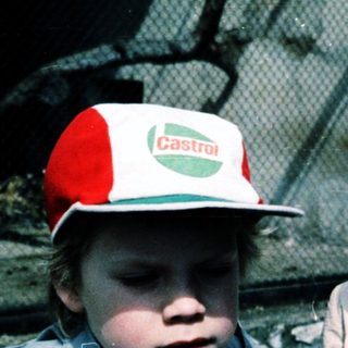 Two children wearing zoo or safari park hats.