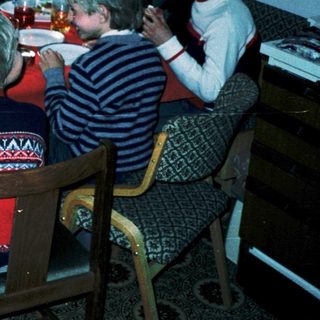Family gathering around a festive dinner table.