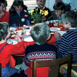 Family gathering around a festive dinner table.
