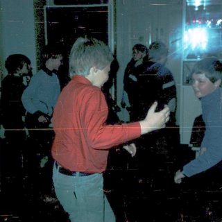 People playing motion-controlled video game indoors.