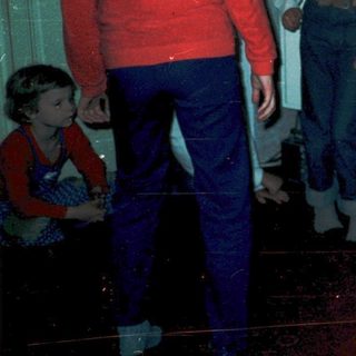 Group of children playing indoors during evening.