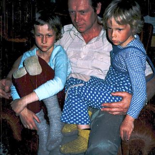 Family indoors during rainy weather.