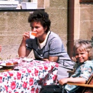 Family picnic outside in backyard.