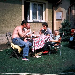 Family picnic outside in backyard.