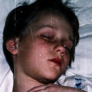A person sleeping peacefully under rain.