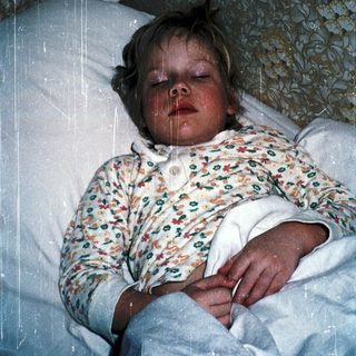 Child sleeping with rain shower on.