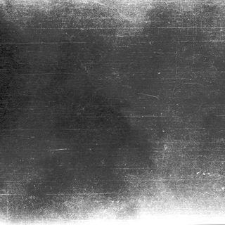 Blurred, faded chalkboard with faint writing.