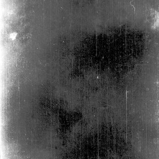 Damaged or faded old metal plate.
