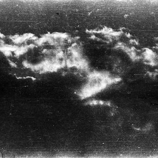 Dark sky with dense, low-lying clouds.